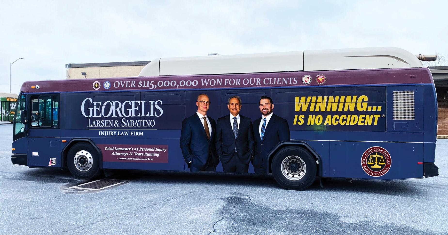 Georgelis Larsen and Sabatino branded bus showing Lancaster personal injury and accident lawyers